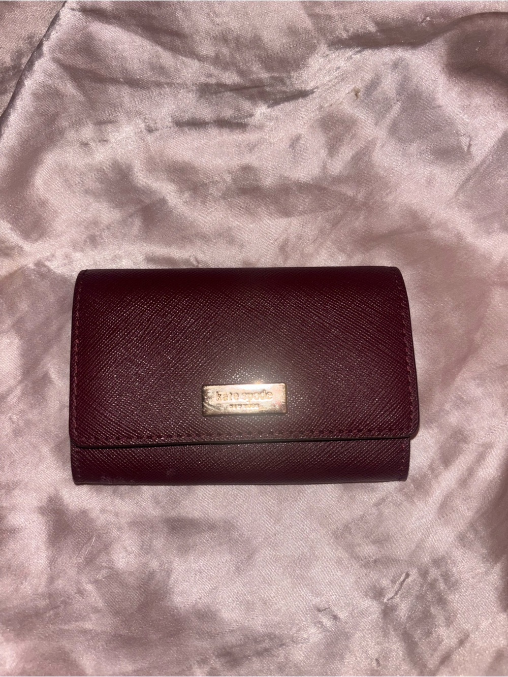 kate spade Burgundy Saffiano Leather Trifold Wallet with Gold Plaque